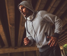 Man running with headphones Stock Photo