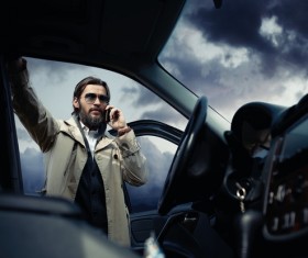 Man standing next to the car Stock Photo