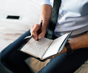 Man writing notes Stock Photo