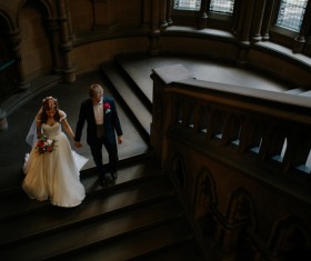 Marriage couple walking on staircase Stock Photo