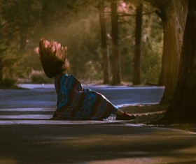 Moment snap of fallen woman on road Stock Photo