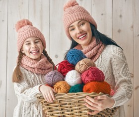 Mother and daughter holding a basket of wool Stock Photo 01
