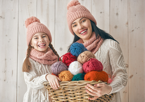 Mother and daughter holding a basket of wool Stock Photo 01