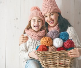 Mother and daughter holding a basket of wool Stock Photo 02