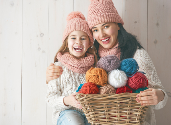 Mother and daughter holding a basket of wool Stock Photo 02