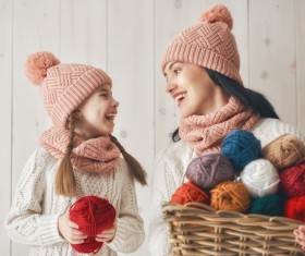 Mother and daughter holding a basket of wool Stock Photo 03