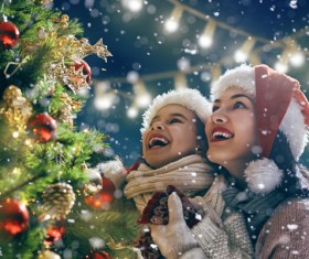 Mother and daughter watching the Christmas tree Stock Photo