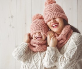 Mother and daughter wearing knit sweaters Stock Photo 01