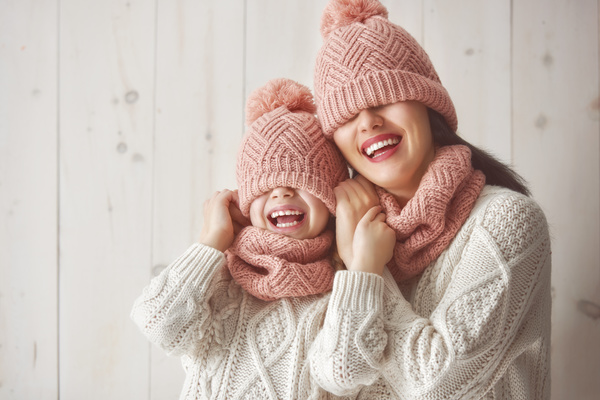 Mother and daughter wearing knit sweaters Stock Photo 01