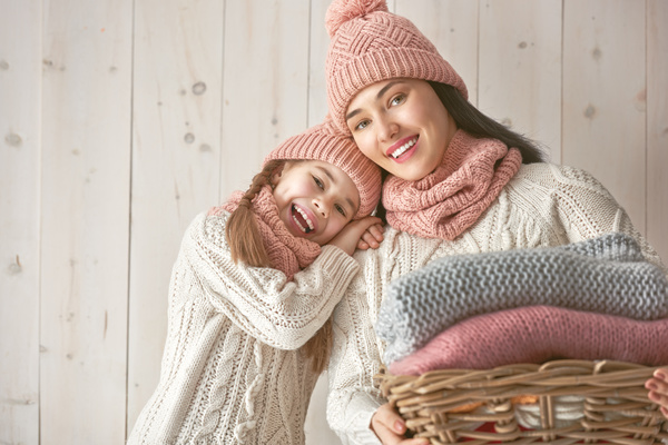 Mother and daughter wearing knit sweaters Stock Photo 02