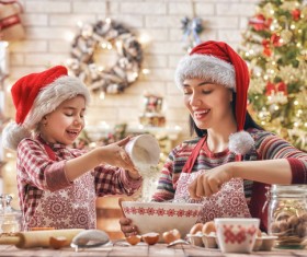 Mother and daughter who make Christmas food in the kitchen Stock Photo 01