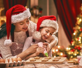 Mother and daughter who make Christmas food in the kitchen Stock Photo 02