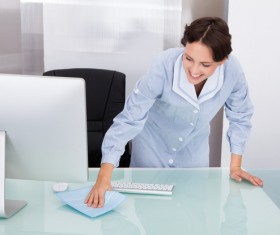 Nurse cleaning the desk Stock Photo