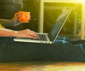 People using laptop drinking coffee Stock Photo 01