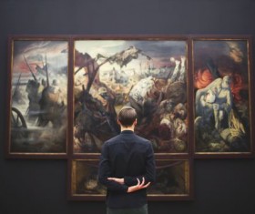 People visiting the exhibition of paintings Stock Photo
