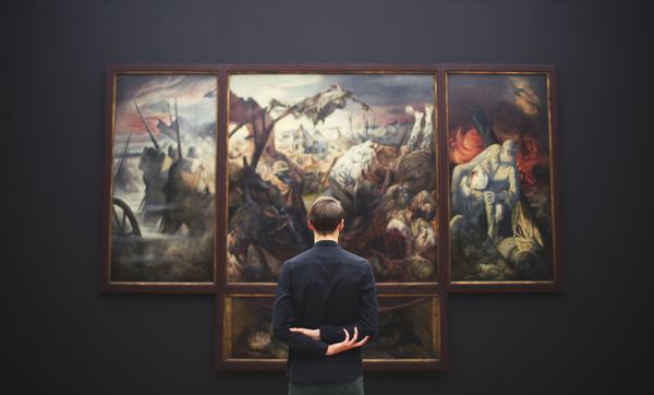 People visiting the exhibition of paintings Stock Photo