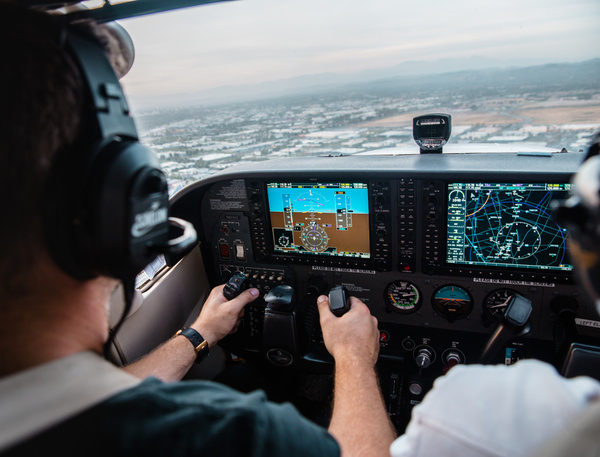 Pilot monitoring helicopter in cabin Stock Photo