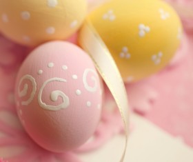 Pink and yellow Easter eggs with ribbons Stock Photo