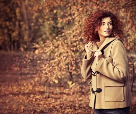 Red haired girl walking in the autumn park Stock Photo 01