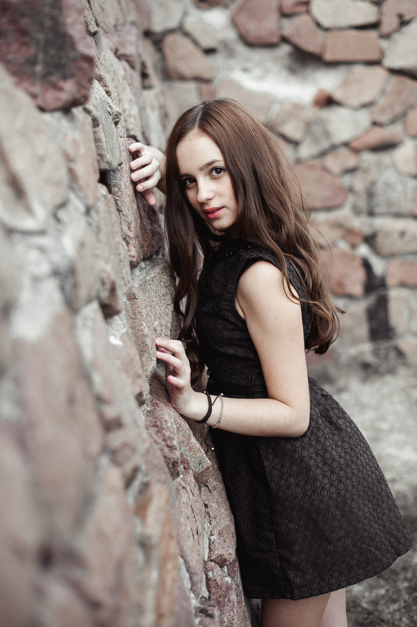 Rely on the wall beautiful young lady Stock Photo 02