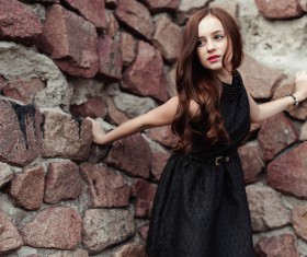 Rely on the wall beautiful young lady Stock Photo 03