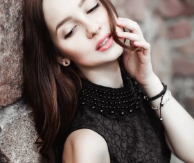 Rely on the wall beautiful young lady Stock Photo 04