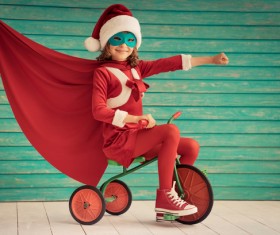 Riding tricycle happy little girl Stock Photo