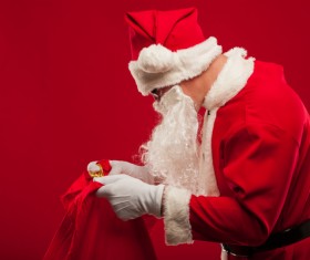 Santa Claus holding Christmas baggage Stock Photo
