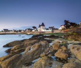 Seaside town and bare reefs Stock Photo 01