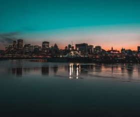 Sparkling modern city on riverside Stock Photo