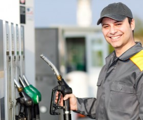Staff holding fuel gun Stock Photo