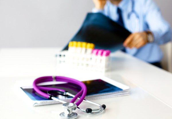 Stethoscope and medical test tube on the desktop Stock Photo