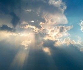 Sunlight penetrating the clouds Stock Photo