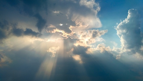 Sunlight penetrating the clouds Stock Photo