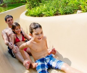 Take the kids play Water slide Father Stock Photo