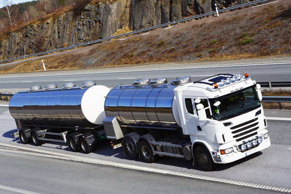 Tank truck driving on the road Stock Photo