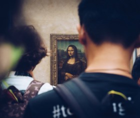 Tourists watch famous paintings in the gallery Stock Photo