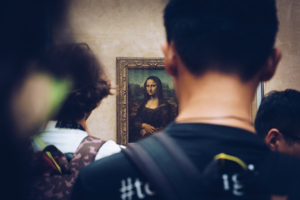 Tourists watch famous paintings in the gallery Stock Photo