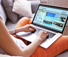 Use laptop to find tourist attractions Stock Photo