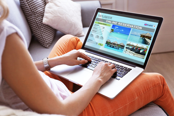 Use laptop to find tourist attractions Stock Photo