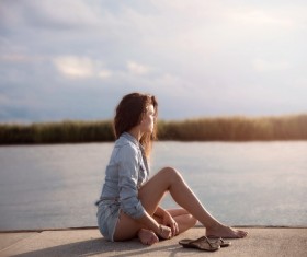 Watch the sunset girl Stock Photo
