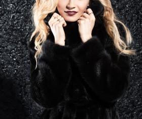 Wearing black mink coat beautiful fashionable blonde Stock Photo 01