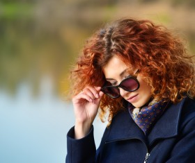Wearing sunglasses red haired woman Stock Photo 01