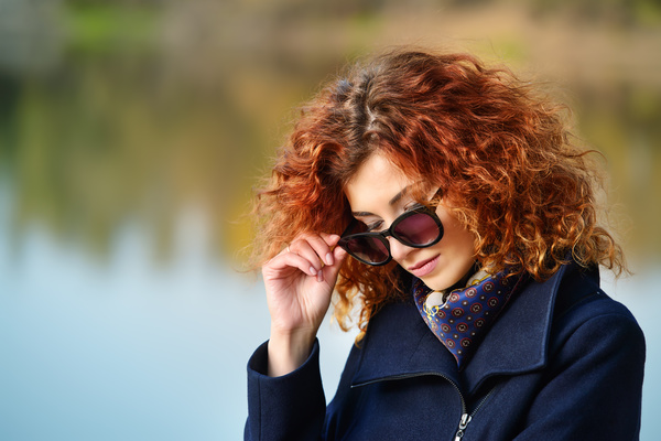 Wearing sunglasses red haired woman Stock Photo 01