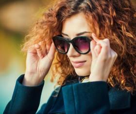 Wearing sunglasses red haired woman Stock Photo 02