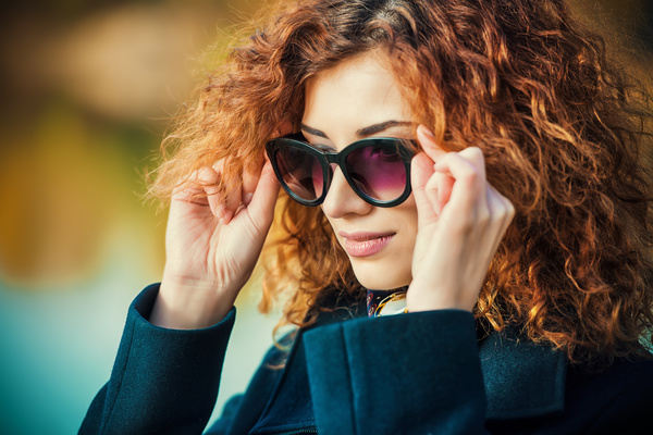 Wearing sunglasses red haired woman Stock Photo 02