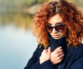 Wearing sunglasses red haired woman Stock Photo 03