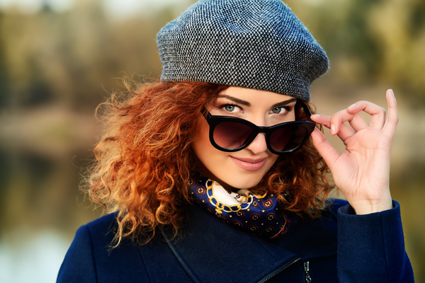 Wearing sunglasses red haired woman Stock Photo 04