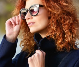 Wearing sunglasses red haired woman Stock Photo 05