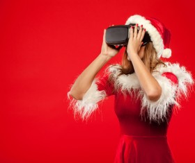 Woman Wearing Christmas Costume Wearing VR Glasses Stock Photo 02